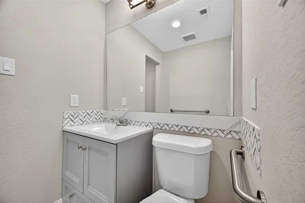 a bathroom with a sink and a toilet