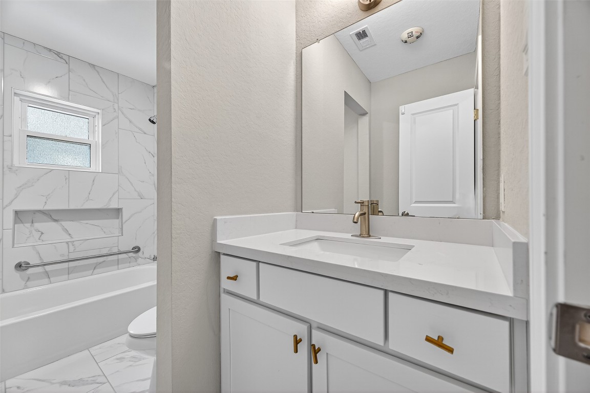 29902 East Hawthorne Drive Spring, TX 77386 - Photo 33 of 43 a bathroom with a sink and a mirror