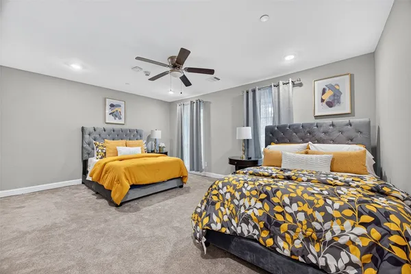 a bedroom with double bed and window