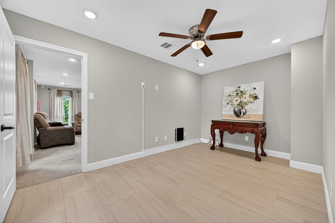 29902 East Hawthorne Drive Spring, TX 77386 - Photo 7 of 43 a view of a livingroom with a couch and a ceiling fan