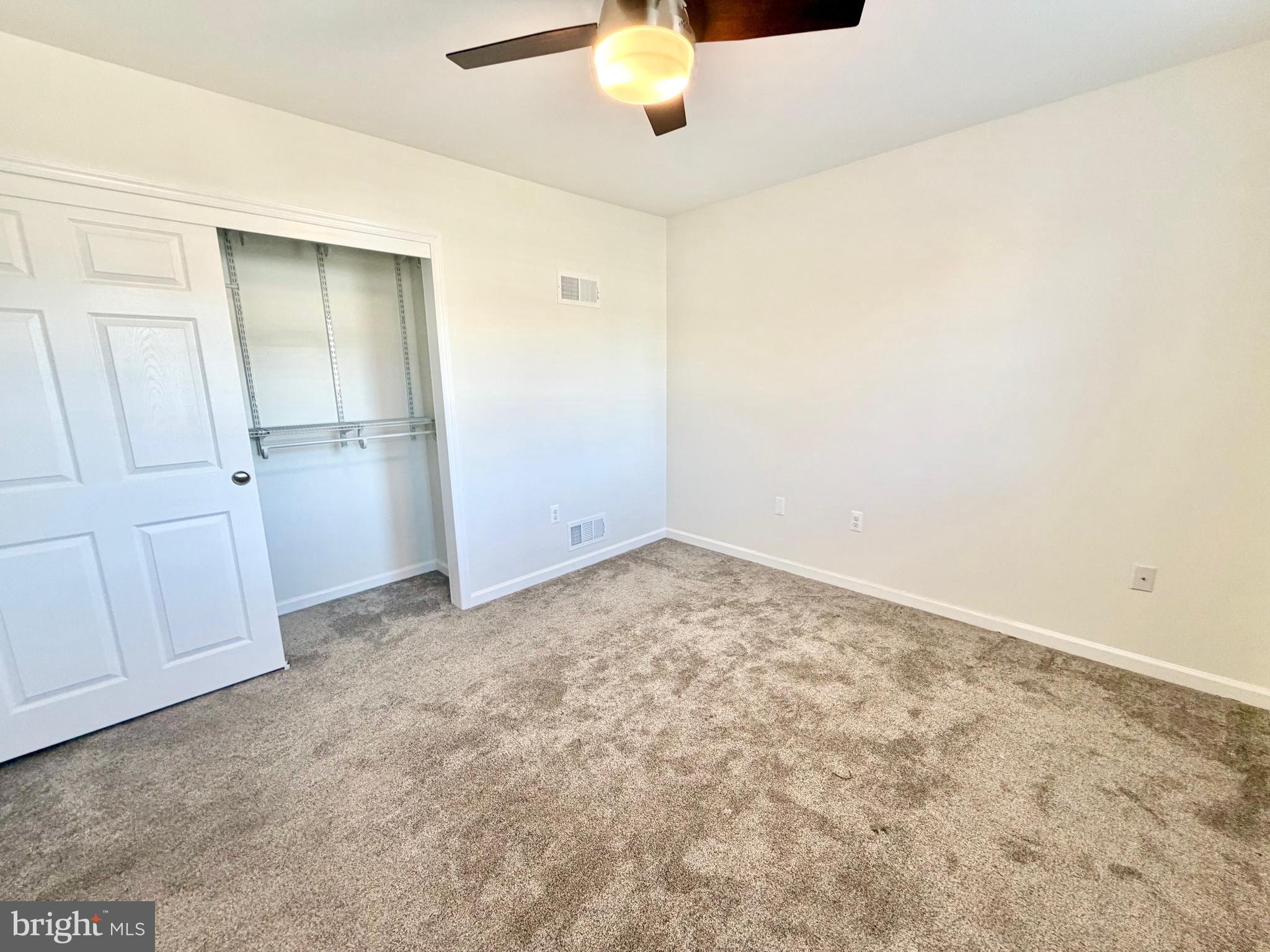 112 Chukar Court Lititz, PA 17543 - Photo 22 of 44 an empty room with a chandelier fan