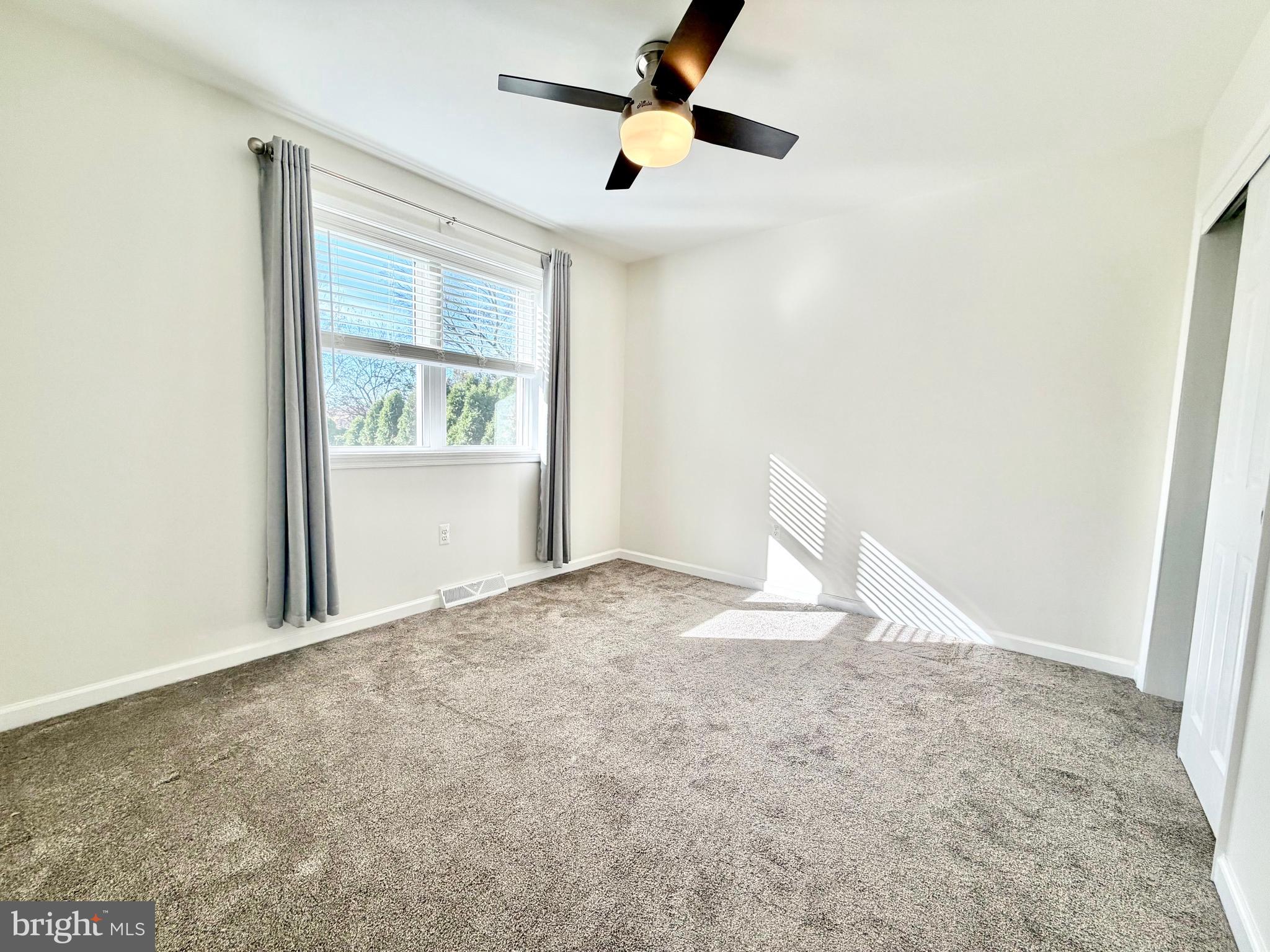 112 Chukar Court Lititz, PA 17543 - Photo 26 of 44 an empty room with a window and ceiling fan