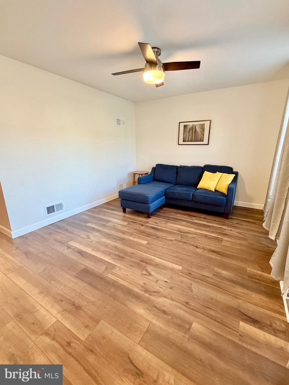 112 Chukar Court Lititz, PA 17543 - Photo 6 of 44 a living room with couch and a wooden floor