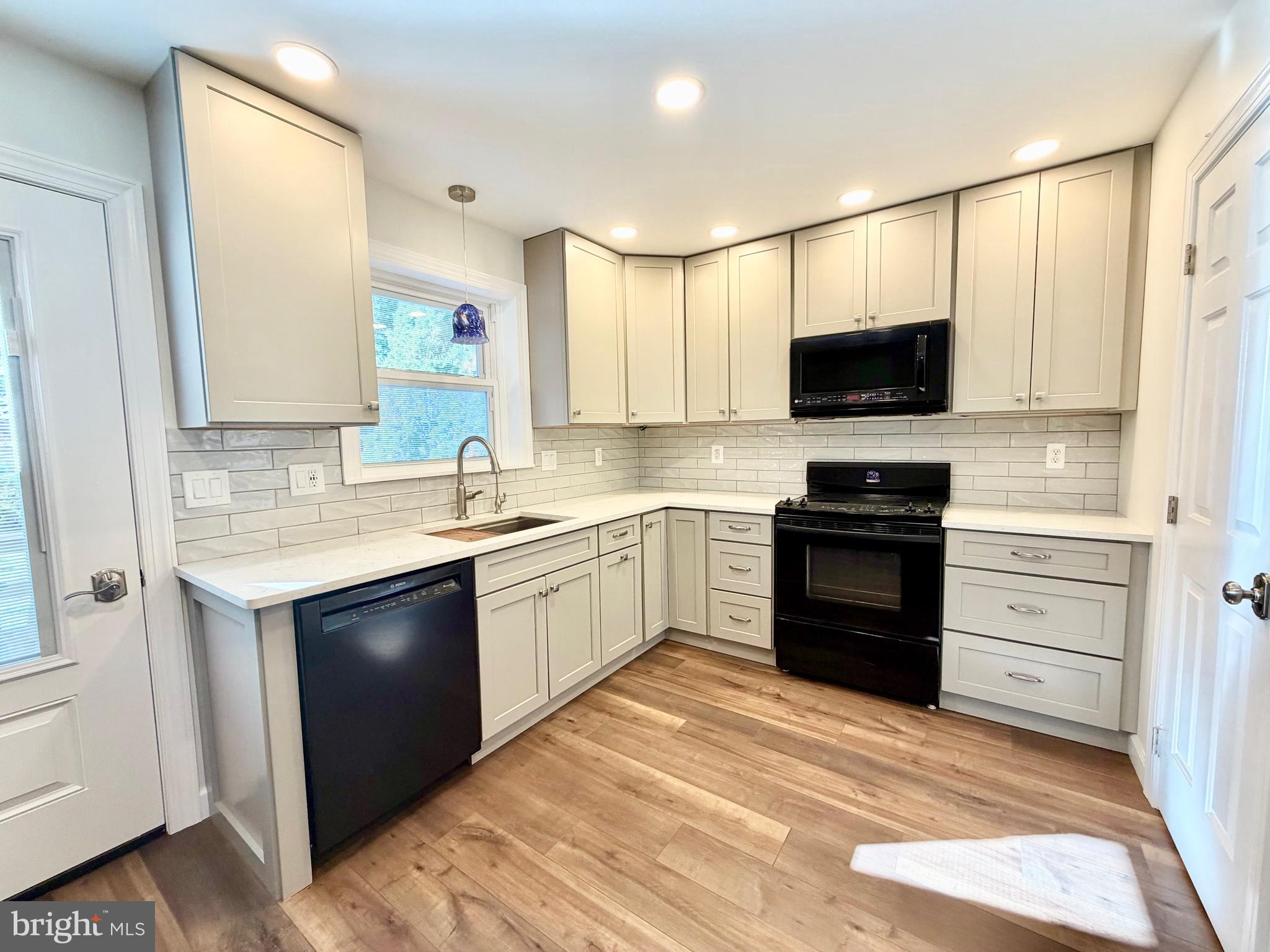 112 Chukar Court Lititz, PA 17543 - Photo 7 of 44 a kitchen with a sink stove and microwave