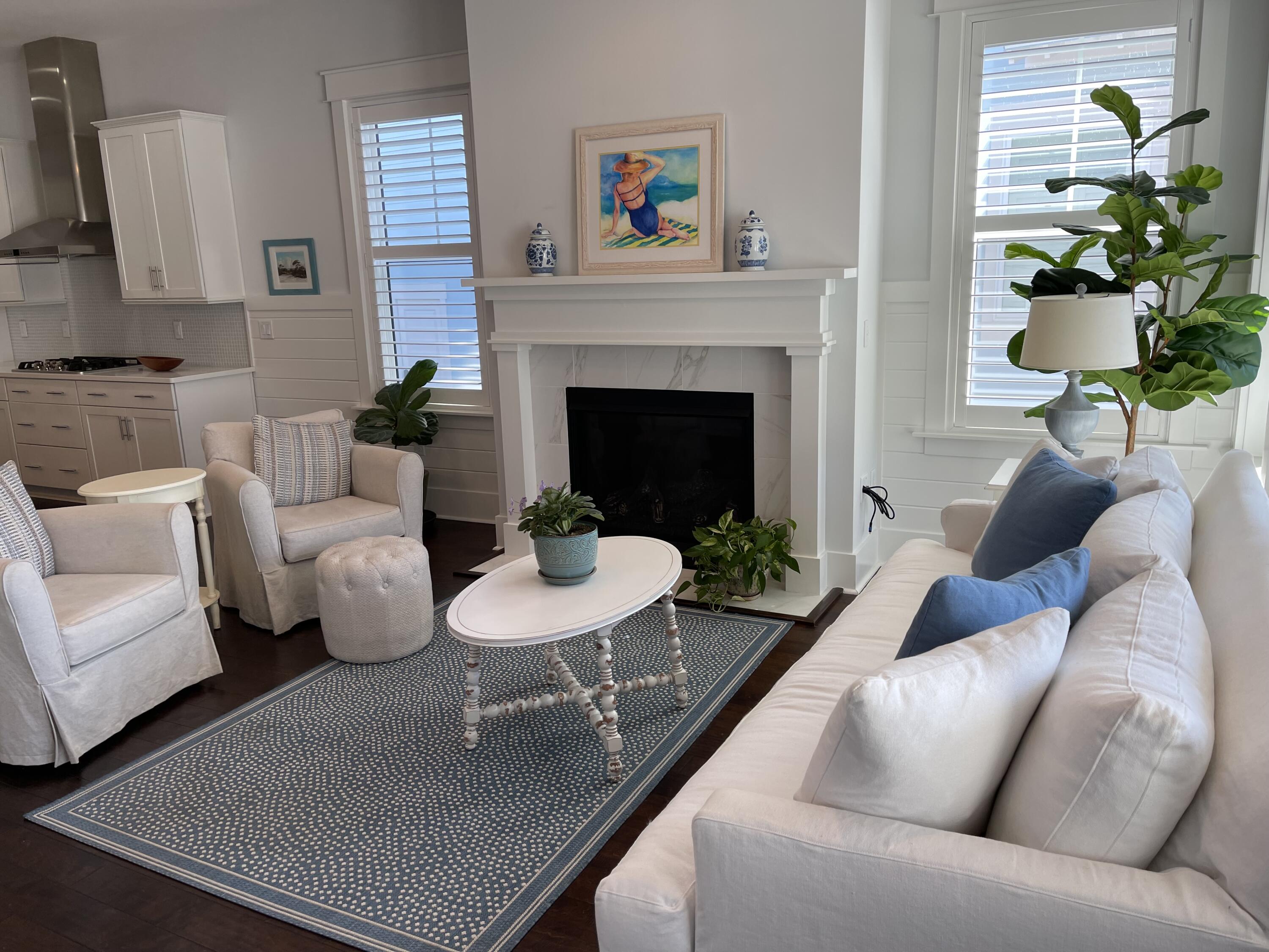 155 Flatwoods Forest Loop Santa Rosa Beach, FL 32459 - Photo 4 of 4 a living room with furniture a potted plant and a fireplace