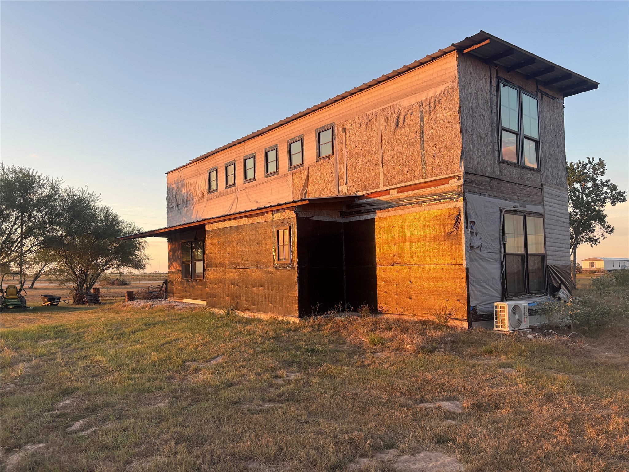7182 Mieth Road Sealy, TX 77474 - Photo 4 of 10 a view of a house with large windows