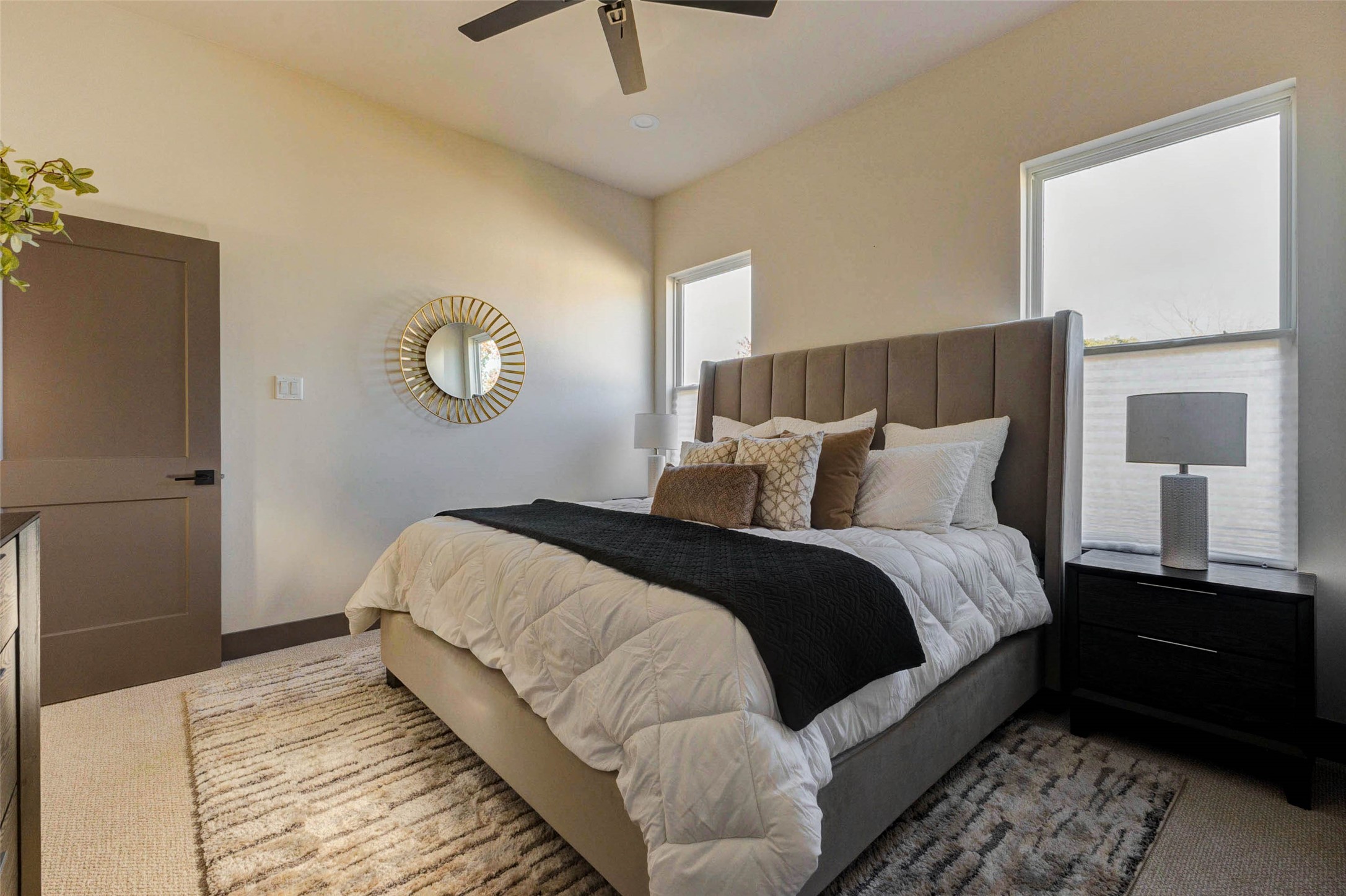 4803 Paula Street Houston, TX 77033 - Photo 15 of 28 The bright, neutral-colored primary bedroom room receives ample natural light and has lux carpeted flooring, creating a cozy atmosphere.