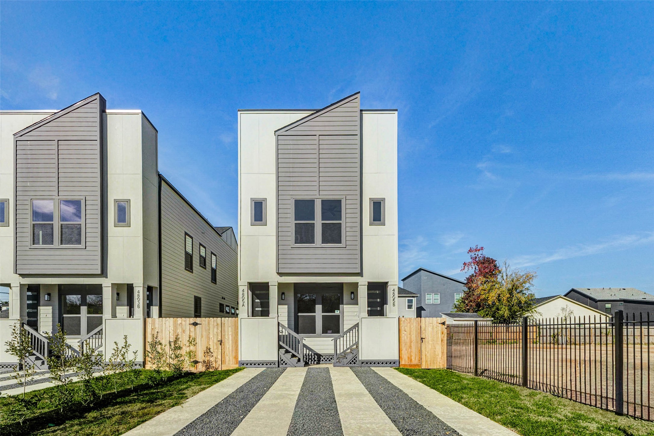 4803 Paula Street Houston, TX 77033 - Photo 2 of 28 The property includes a double driveway, a small front yard, and a gated fence, offering privacy and a secure living space.