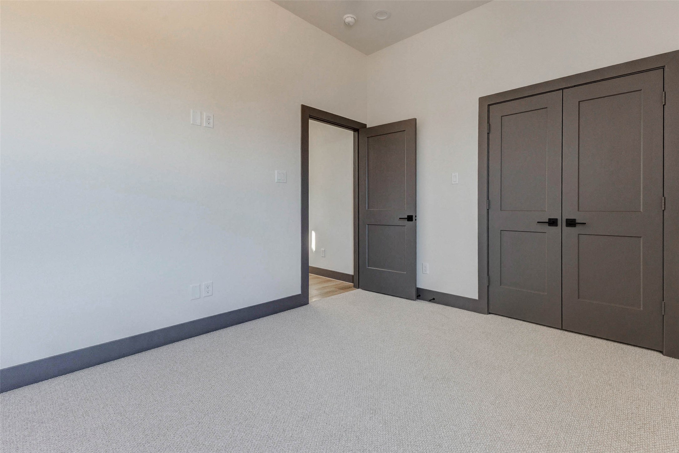 4803 Paula Street Houston, TX 77033 - Photo 22 of 28 The 2nd bedroom features a clean, modern design with neutral walls and lux carpeting, a ceiling fan, recessed lighting, and a double-door closet.
