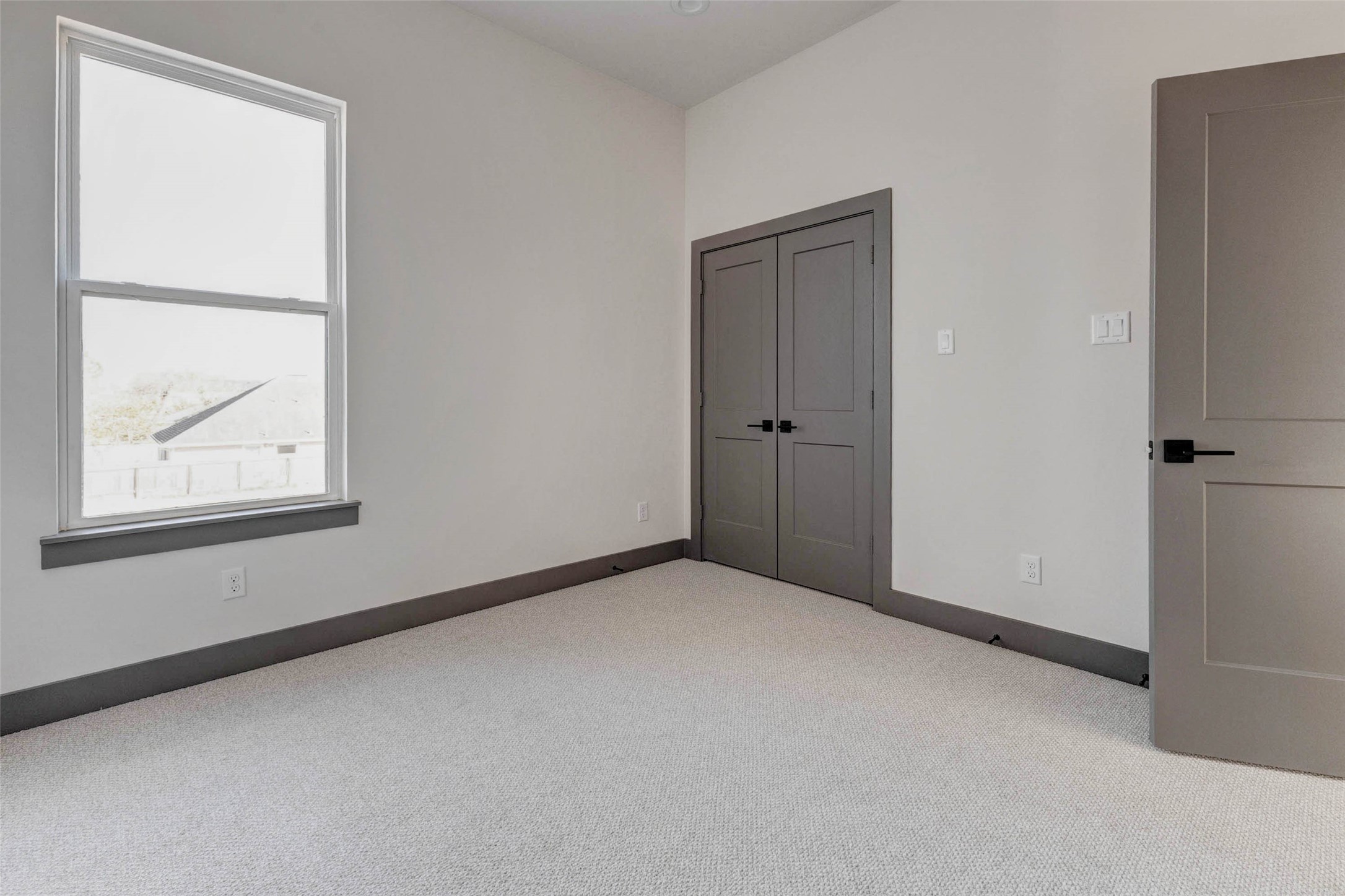 4803 Paula Street Houston, TX 77033 - Photo 24 of 28 The 3rd bedroom features a clean, modern design with light walls, a ceiling fan, and ample natural light.