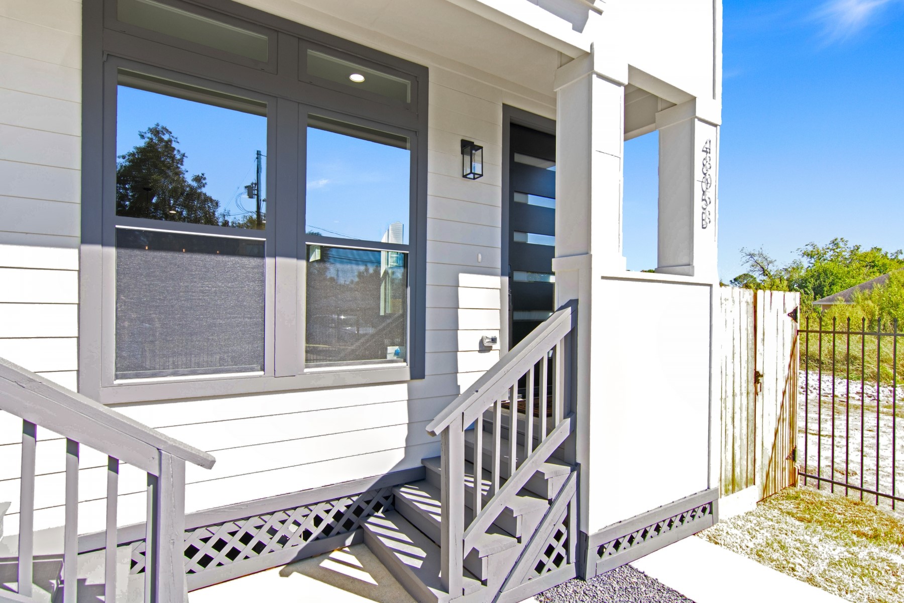 4803 Paula Street Houston, TX 77033 - Photo 3 of 28 Charming entrance with gray accents, featuring a modern 8 ft door and large windows for ample natural light. Unit A is located on the 2nd level and Unit B is located on the 1st level.