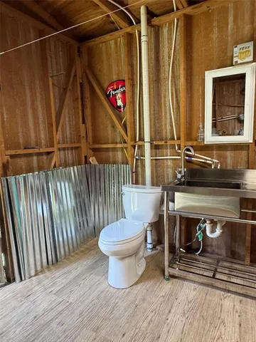 a view of outdoor space with wooden floor and barbecue grill