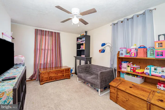 a bedroom with furniture and a chair