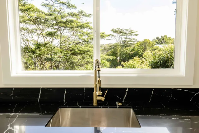 a bathroom with a sink and a window