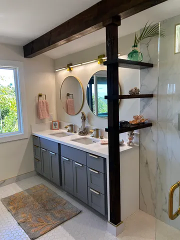 a bathroom with a double vanity sink and a mirror