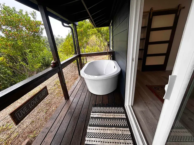 a bathroom with a sink and a rug