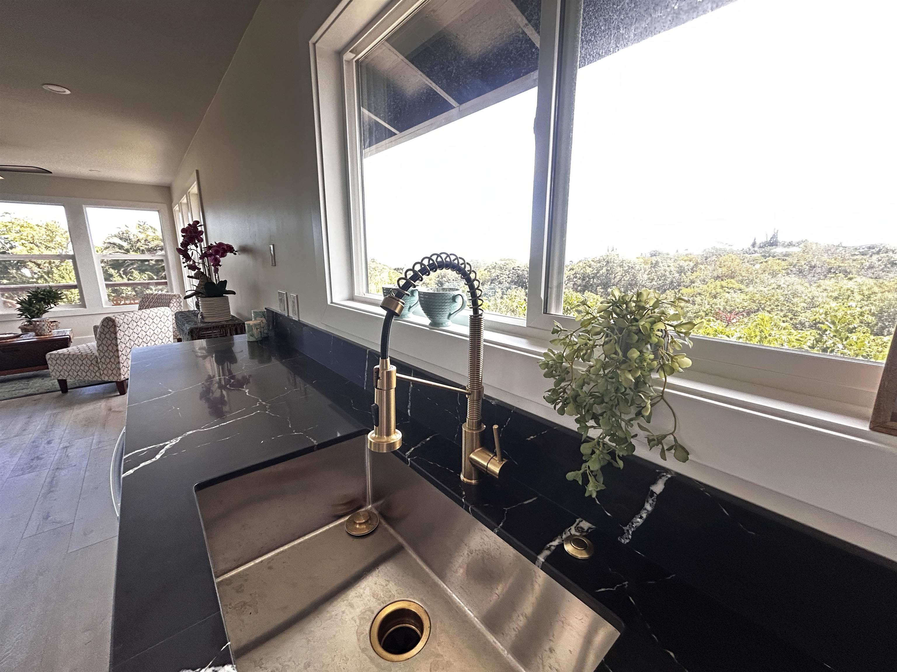 1139 Kauhikoa Road, Unit A Haiku, HI 96708 - Photo 3 of 42 a dining room with table and chairs