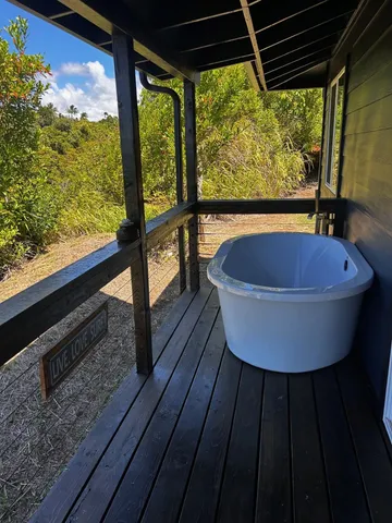 a table and chairs sitting in a back yard of a building