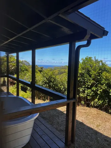 a view of two chairs in the balcony