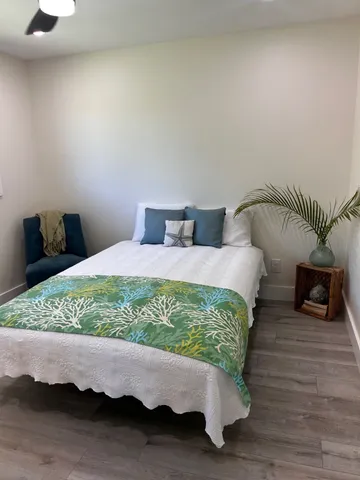 a bed room with a bed and a television