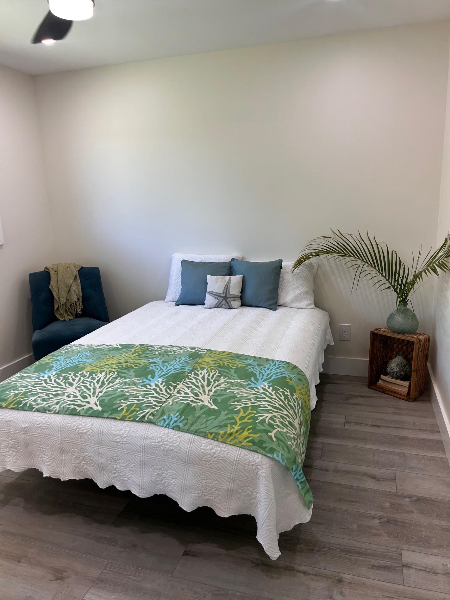 1139 Kauhikoa Road, Unit A Haiku, HI 96708 - Photo 33 of 42 a bed room with a bed and a television