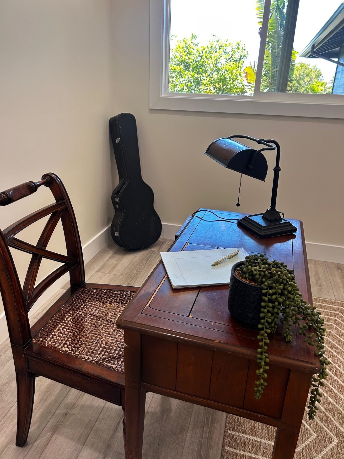 1139 Kauhikoa Road, Unit A Haiku, HI 96708 - Photo 39 of 42 a table chair sitting in a room next to a window