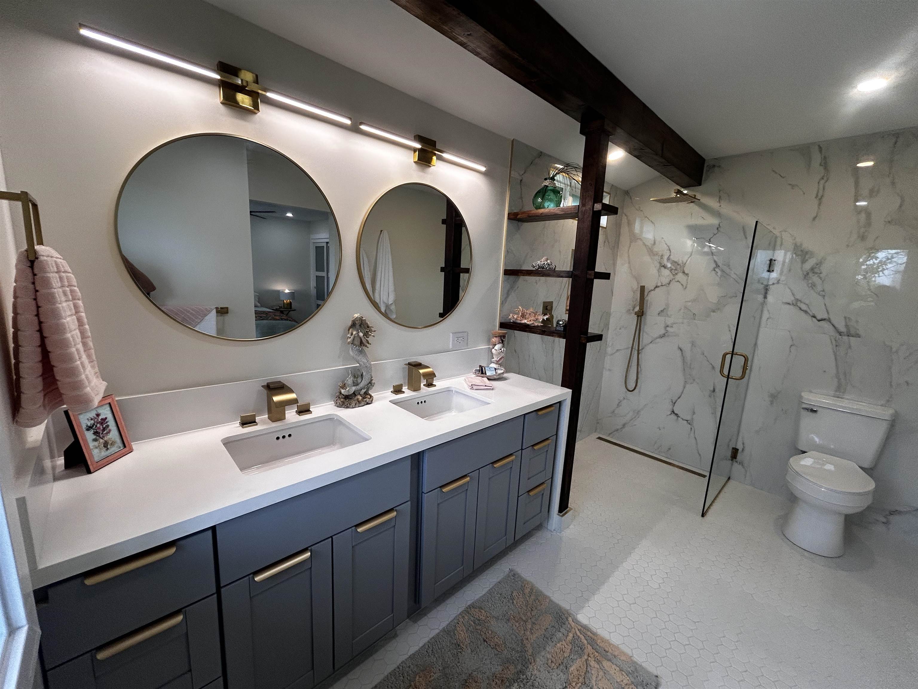 1139 Kauhikoa Road, Unit A Haiku, HI 96708 - Photo 5 of 42 a bathroom with a double vanity sink mirror and toilet