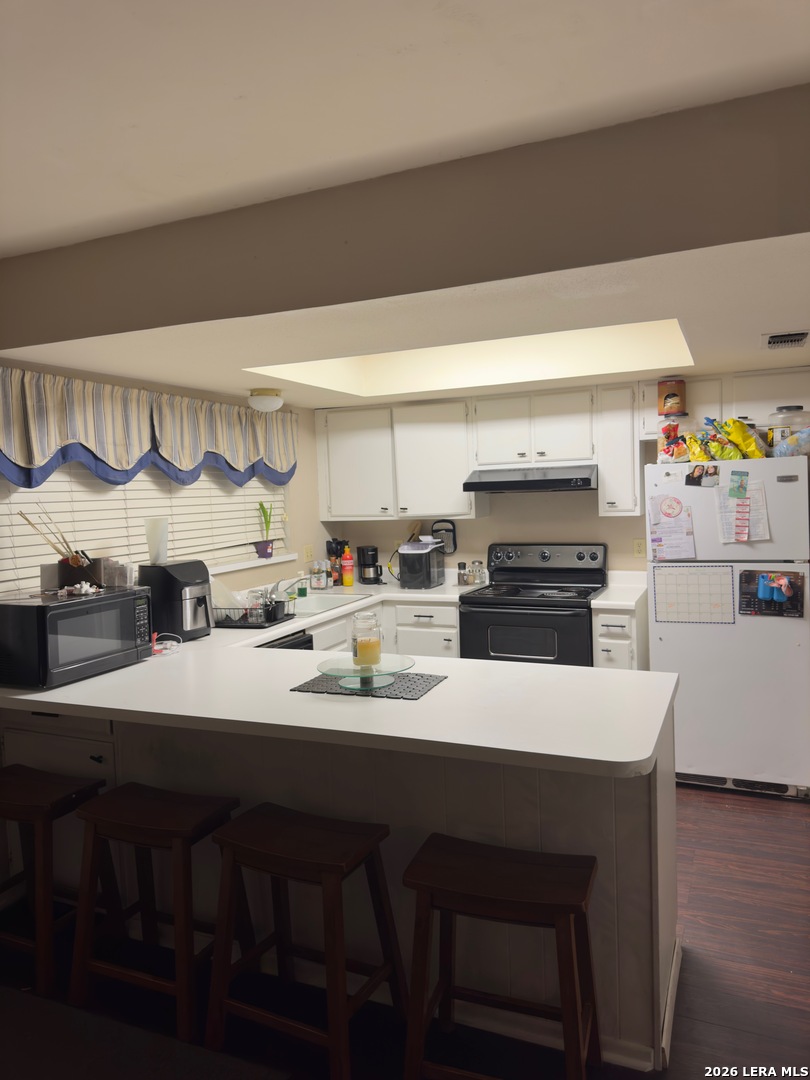 6751 Crown Ridge San Antonio, TX 78239 - Photo 4 of 4 a kitchen with a sink cabinets and wooden floor