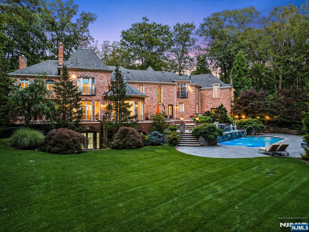 47 Fox Hedge Road Saddle River, NJ 07458 - Photo 1 of 24 a view of a house with a yard and sitting area