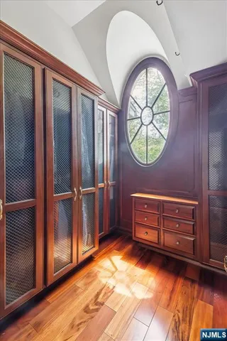 a view of room with window and wooden floor