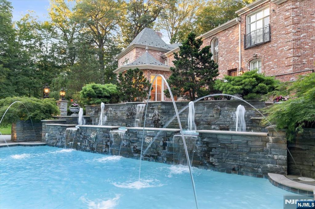 47 Fox Hedge Road Saddle River, NJ 07458 - Photo 19 of 22 a front view of a house with parking