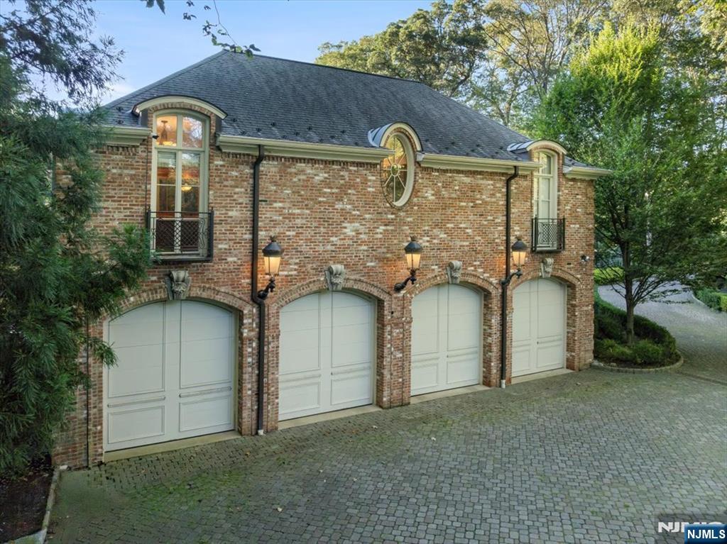 47 Fox Hedge Road Saddle River, NJ 07458 - Photo 20 of 22 a front view of a house with garden
