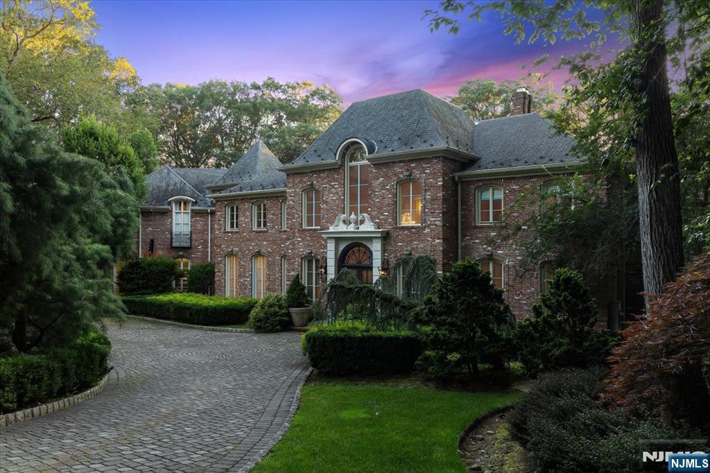 47 Fox Hedge Road Saddle River, NJ 07458 - Photo 23 of 24 a front view of a house with a garden