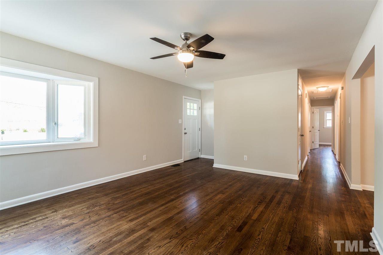 508 Cooper Road Raleigh, NC 27610 - Photo 3 of 25 a view of empty room with wooden floor and fan