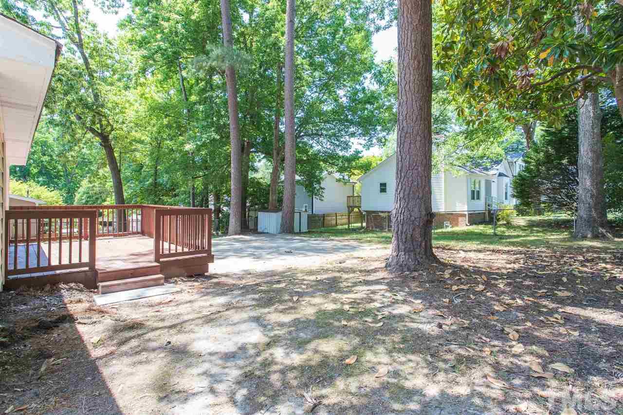 508 Cooper Road Raleigh, NC 27610 - Photo 23 of 25 a view of a house with backyard and tree