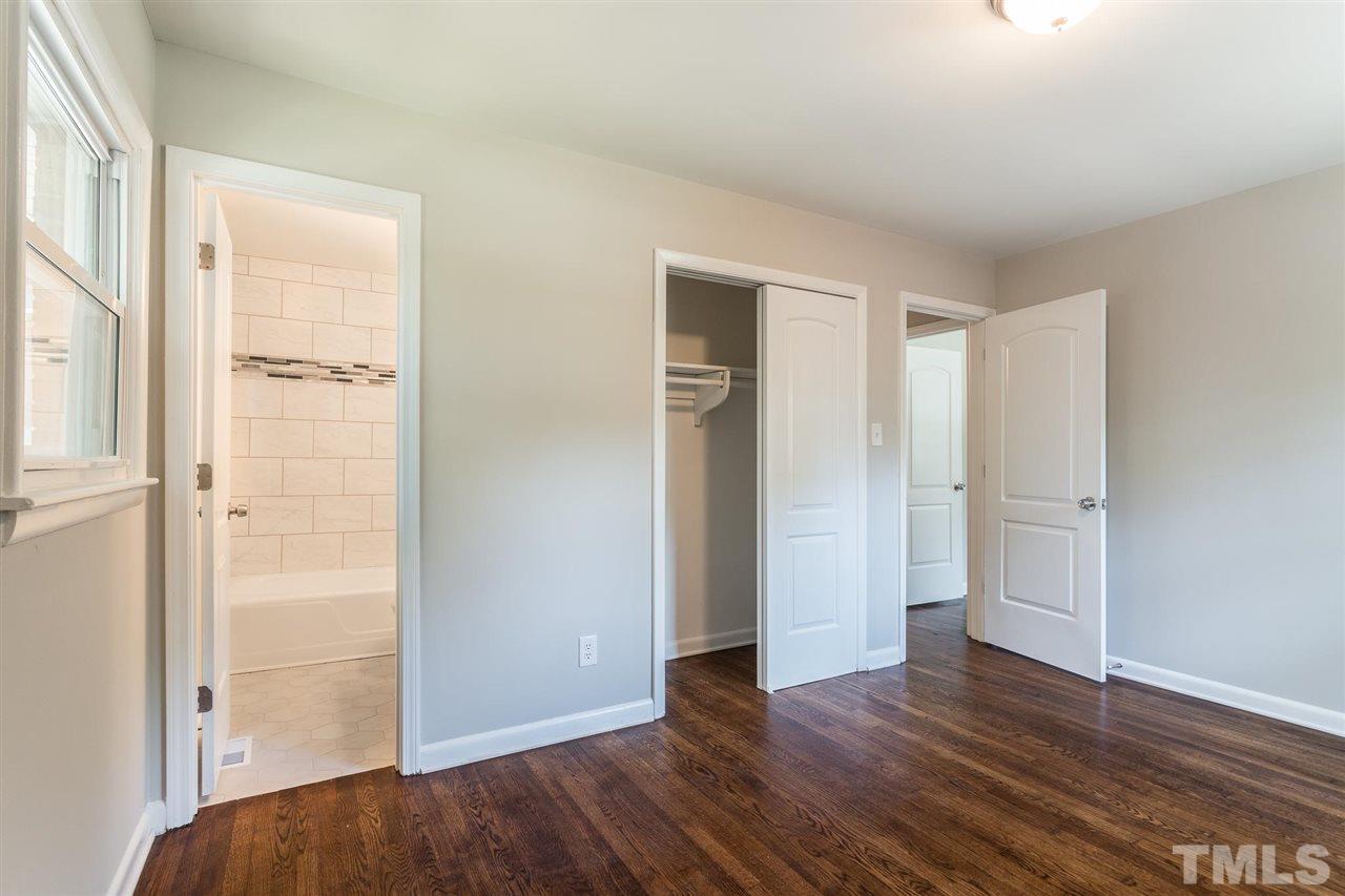 508 Cooper Road Raleigh, NC 27610 - Photo 5 of 25 an empty room with wooden floor & closet area