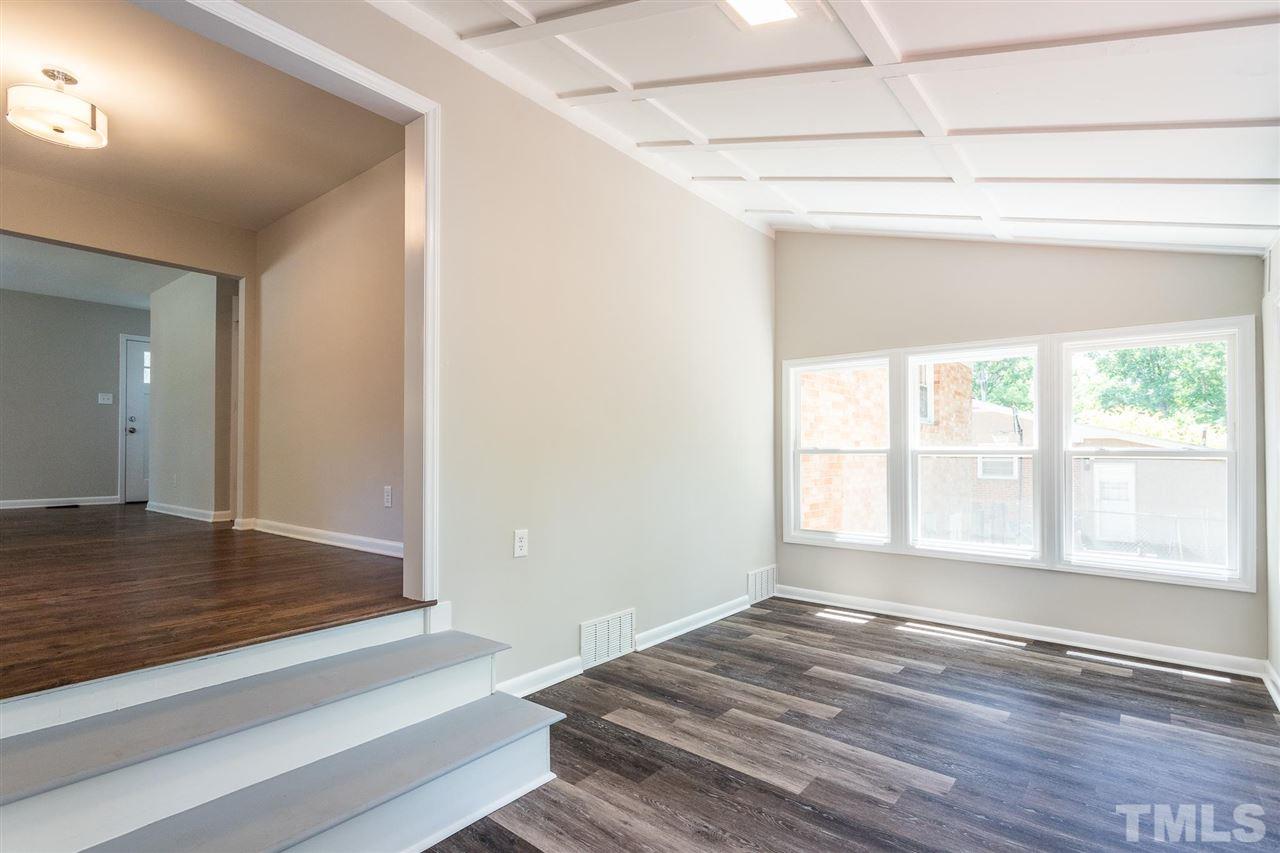 508 Cooper Road Raleigh, NC 27610 - Photo 10 of 25 a view of empty room with wooden floor and fan