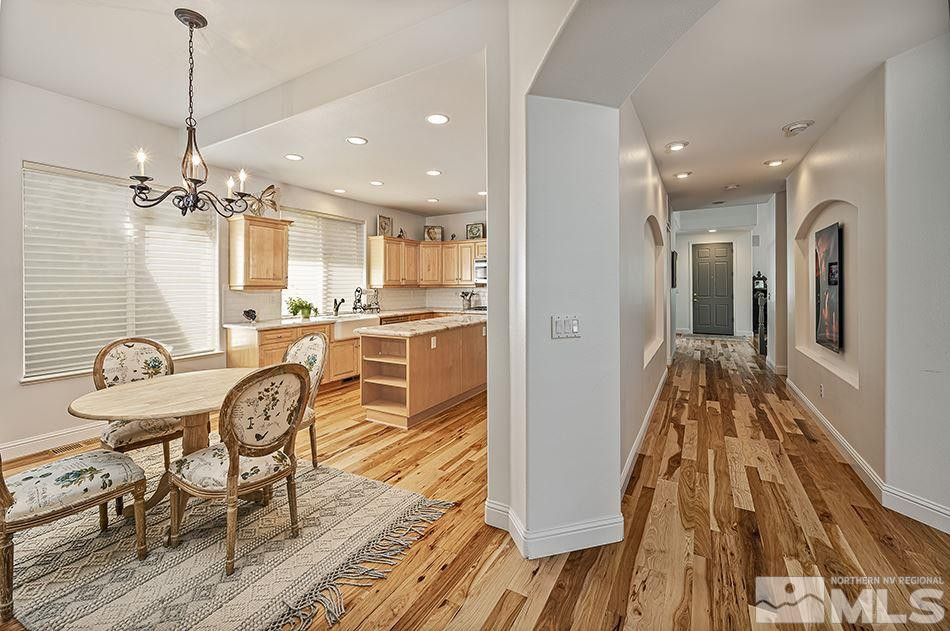 1790 Caughlin Creek Road Reno, NV 89519 - Photo 6 of 27 a very nice looking kitchen with a large dining table and wooden floor