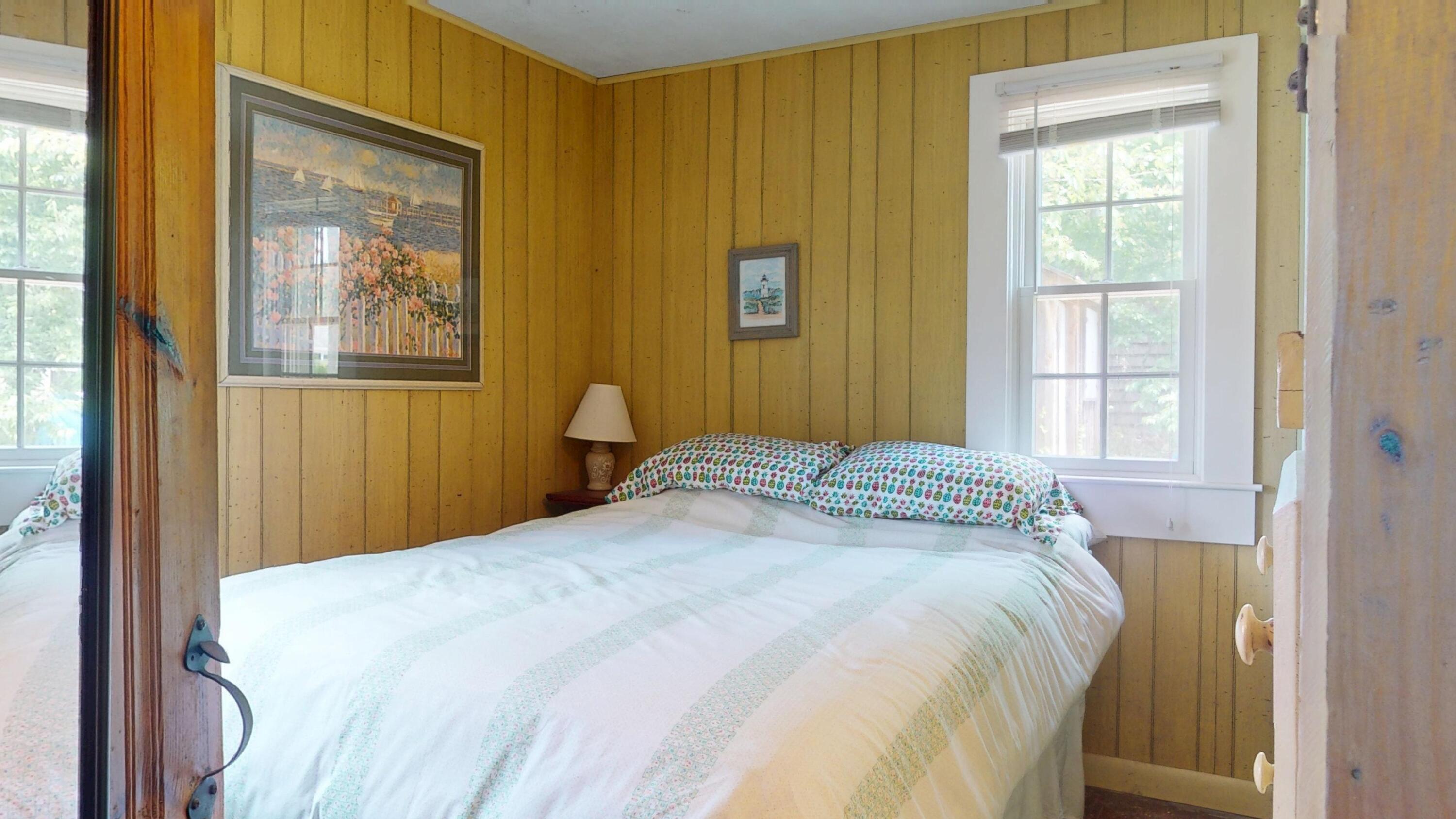 18 Myrtle Lane Dennis Port, MA 02639 - Photo 14 of 25 a bedroom with a bed and a window