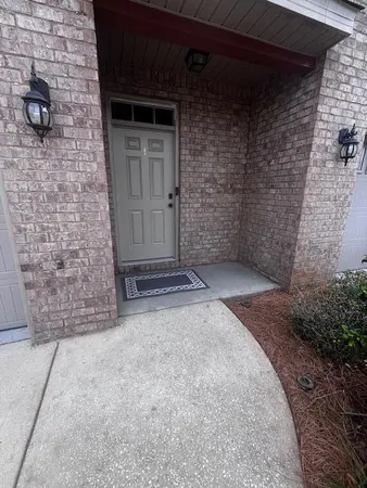 a front view of a house with yard