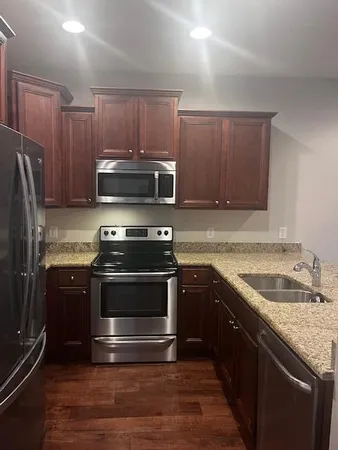 a view of hallway with cabinets