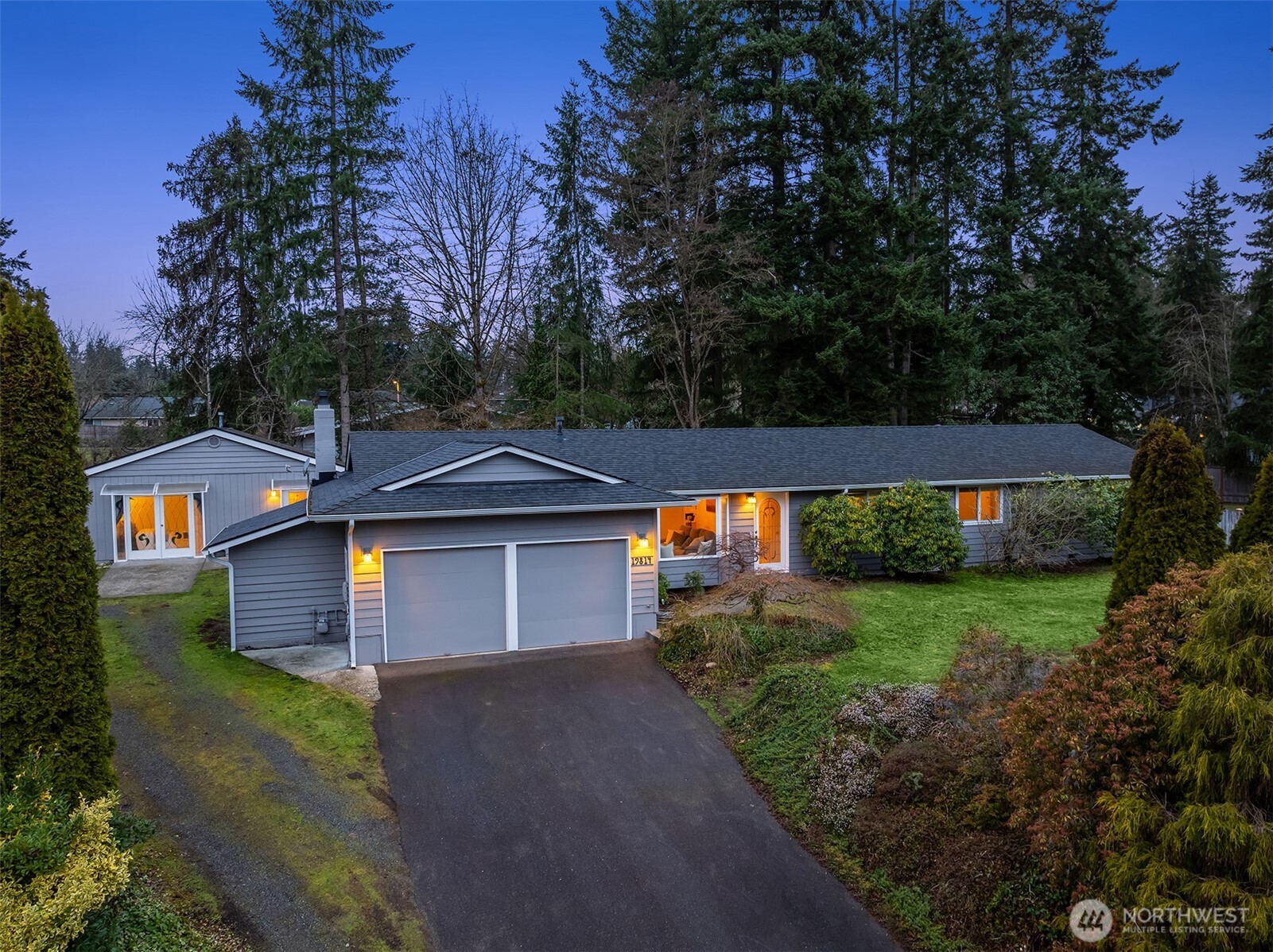 19814 10th Drive Southeast Bothell, WA 98012 - Photo 1 of 40 a front view of a house with a yard and garage