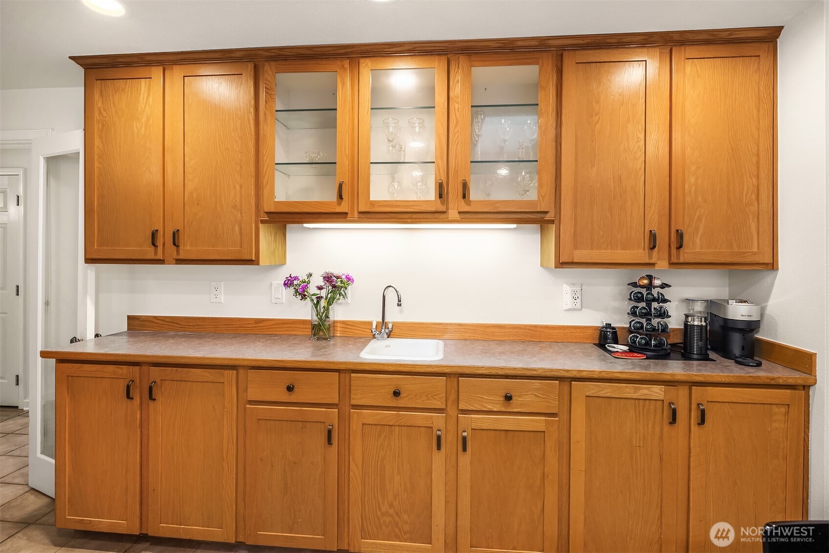 19814 10th Drive Southeast Bothell, WA 98012 - Photo 12 of 40 a kitchen with a sink cabinets and a window