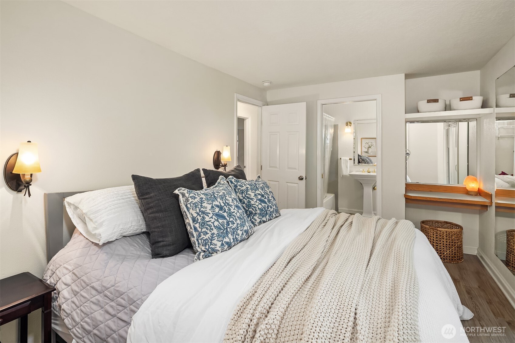 19814 10th Drive Southeast Bothell, WA 98012 - Photo 16 of 40 a bedroom with a bed and a chandelier