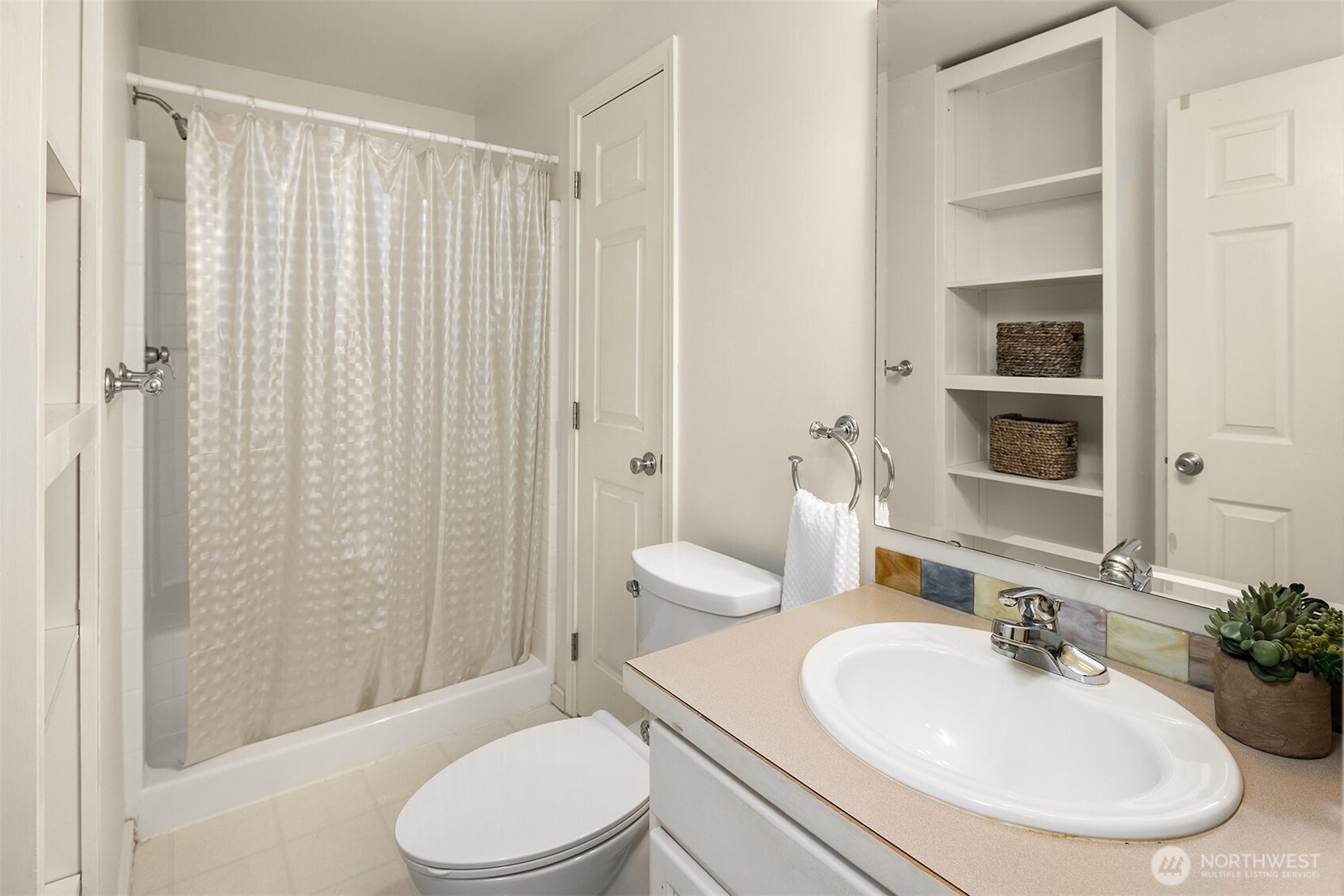 19814 10th Drive Southeast Bothell, WA 98012 - Photo 23 of 40 a bathroom with a sink toilet and shower