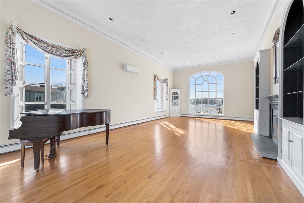 2 Foster Street Marblehead, MA 01945 - Photo 11 of 42 a view of an empty room with window and wooden floor