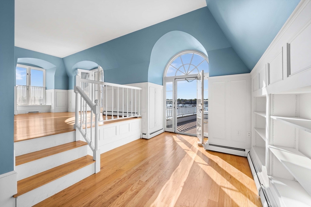 2 Foster Street Marblehead, MA 01945 - Photo 15 of 42 a view of a living room with wooden floor and furniture