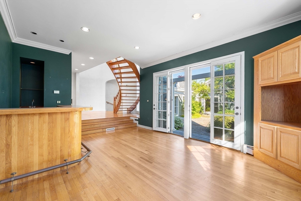 2 Foster Street Marblehead, MA 01945 - Photo 22 of 42 wooden floor in an empty room with a window