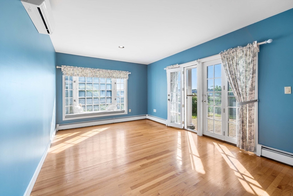 2 Foster Street Marblehead, MA 01945 - Photo 23 of 42 a view of an empty room with wooden floor and a window