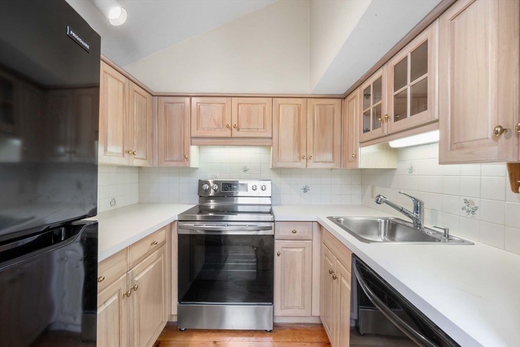 2 Foster Street Marblehead, MA 01945 - Photo 29 of 42 a kitchen with cabinets stainless steel appliances and a sink